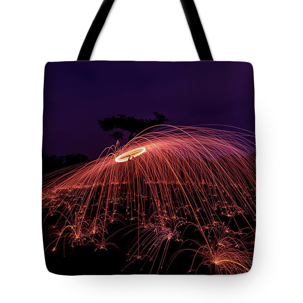 Fire Tote Bag featuring the photograph Spinning fire by Andrew Lalchan