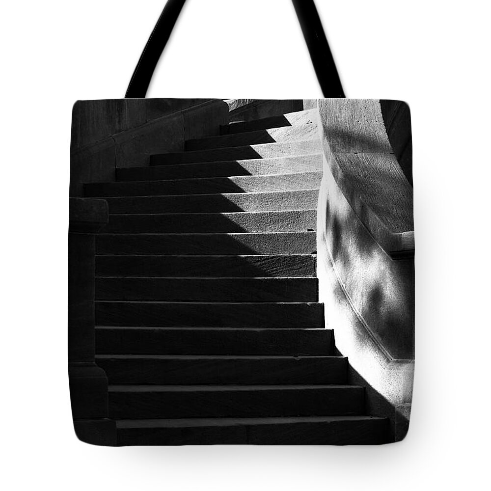 Architecture Tote Bag featuring the photograph Spiral stairs and shadows by Charles Floyd