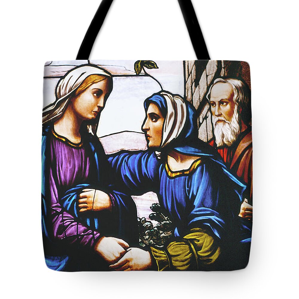 Stained Glass Tote Bag featuring the photograph stained glass prints - The Visitation by Sharon Hudson