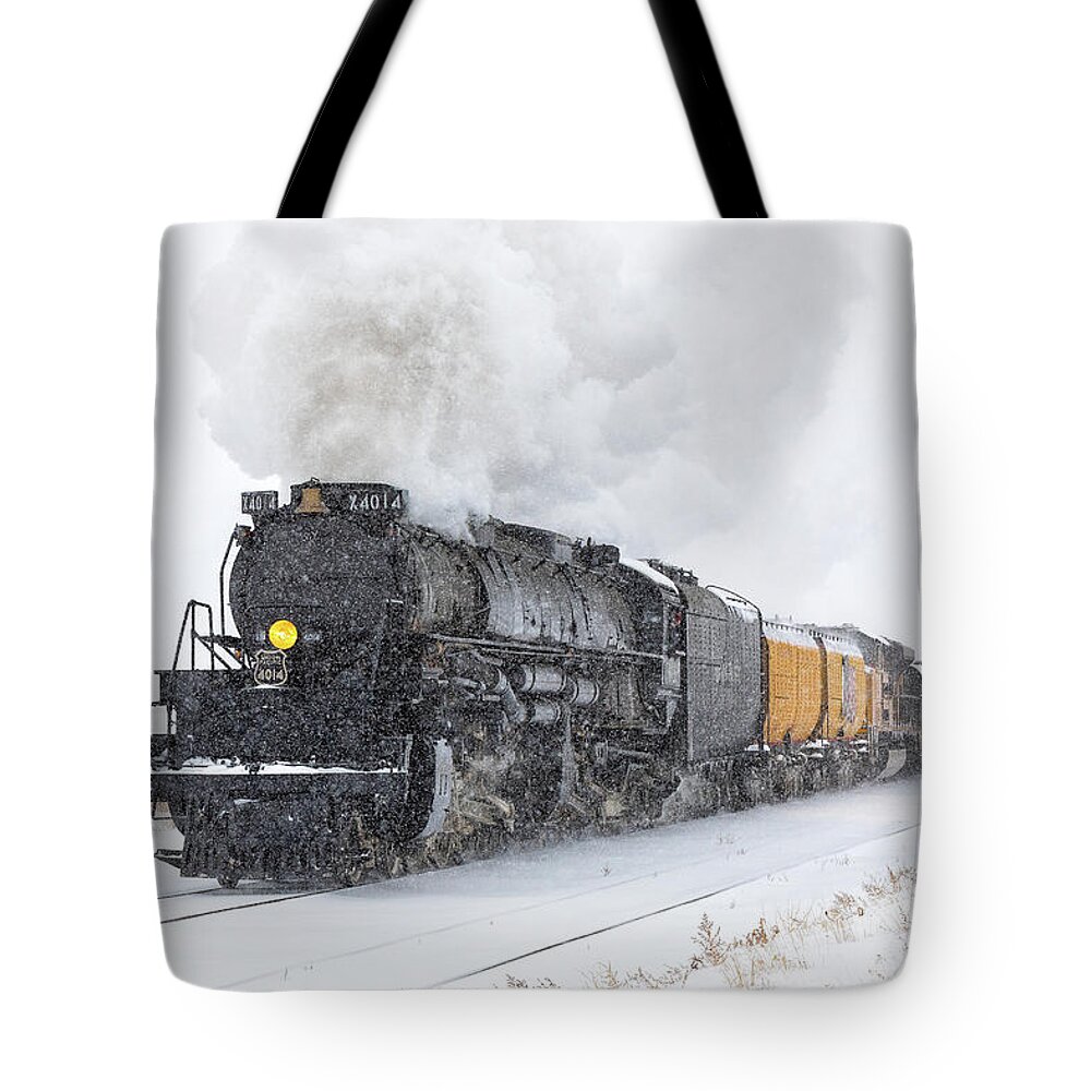Train Tote Bag featuring the photograph Steam Engine Races Through a Snowstorm by Tony Hake