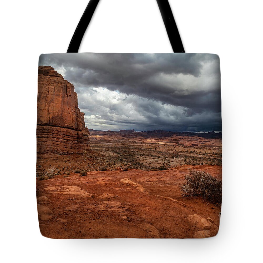 Arches National Park Tote Bag featuring the photograph Storm Clouds over Arches National Park in Moab Utah by Ronda Kimbrow