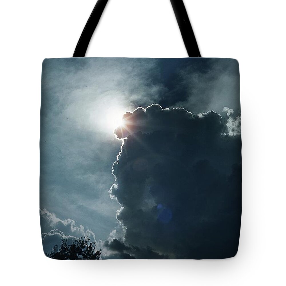 Sun Tote Bag featuring the photograph Storm Clouds Sun and Eagles by Russel Considine