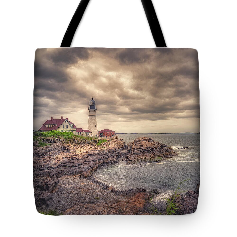 Portland Head Lighthouse Tote Bag featuring the photograph Stormy Afternoon at Portland Head Light by Penny Polakoff