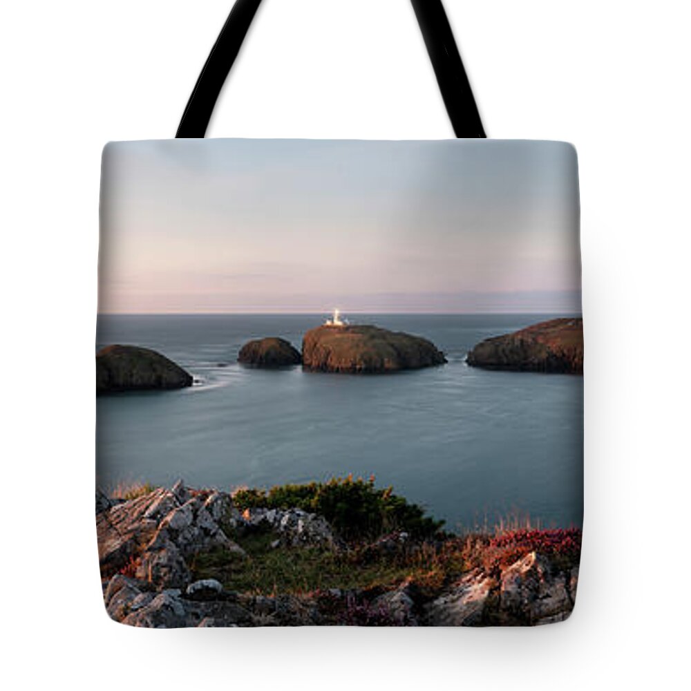 Panorama Tote Bag featuring the photograph Strumble Head Lighthouse sunset Pembrokeshire Coast Wales by Sonny Ryse