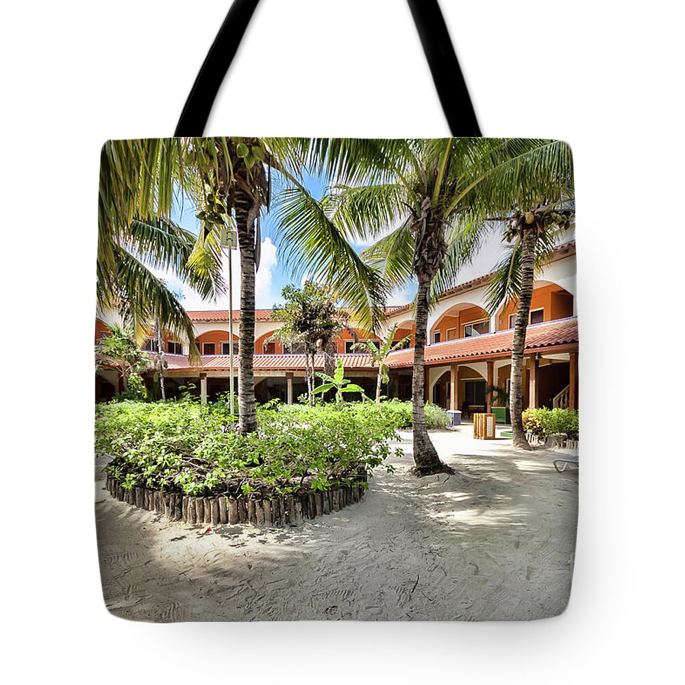 Ambergris Caye Tote Bag featuring the photograph Sun Breeze Hotel by Lawrence Burry