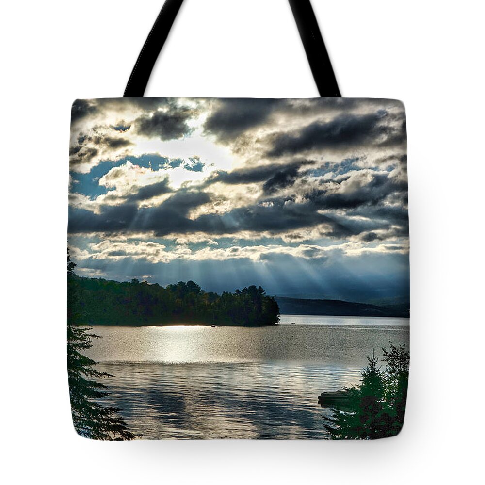 Sun Tote Bag featuring the photograph Sun Rays and Storm Clouds Over Rangeley Maine by Russel Considine