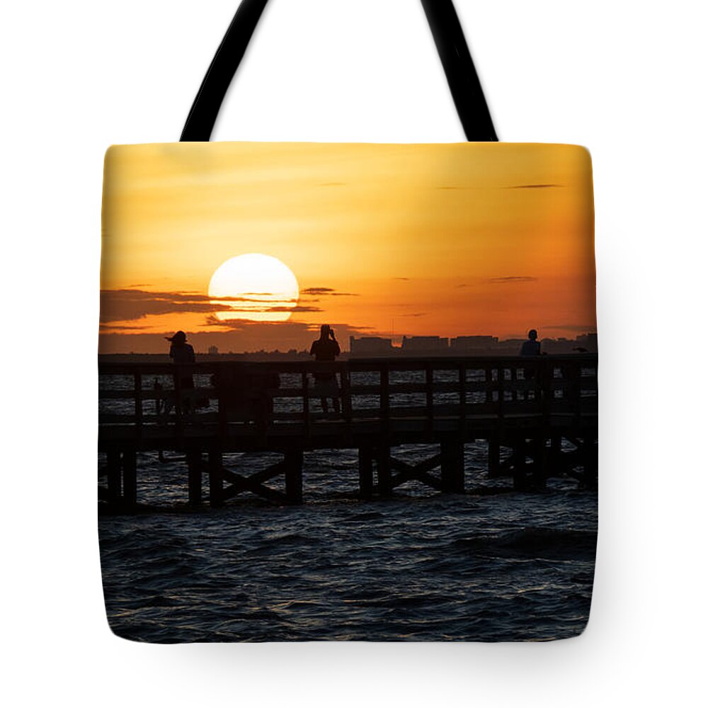 Sunrise Tote Bag featuring the photograph Sunrise over the Safety Harbor Pier by L Bosco