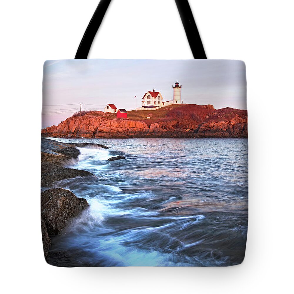 Nubble Tote Bag featuring the photograph Sunset at Nubble Light by Eric Gendron