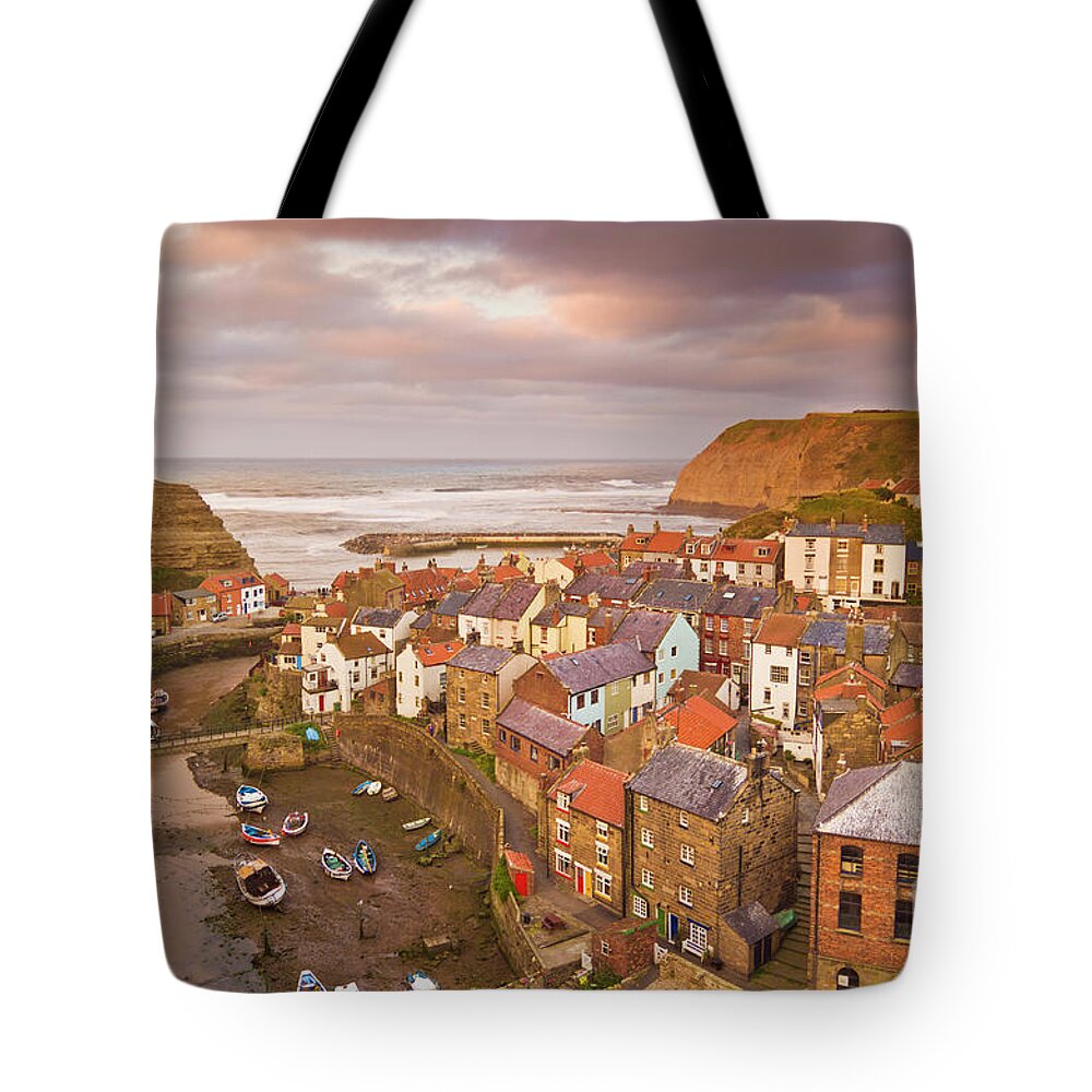 Staithes Yorkshire Tote Bag featuring the photograph Sunset at Staithes, Yorkshire, England by Neale And Judith Clark