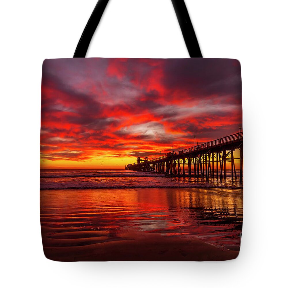 Fiery Tote Bag featuring the photograph Sunset Reflections in Oceanside by Rich Cruse