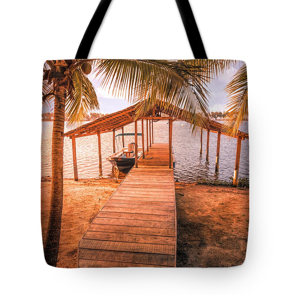 African Tote Bag featuring the photograph Swaying Palms Over the Dock At Sunset by Debra and Dave Vanderlaan