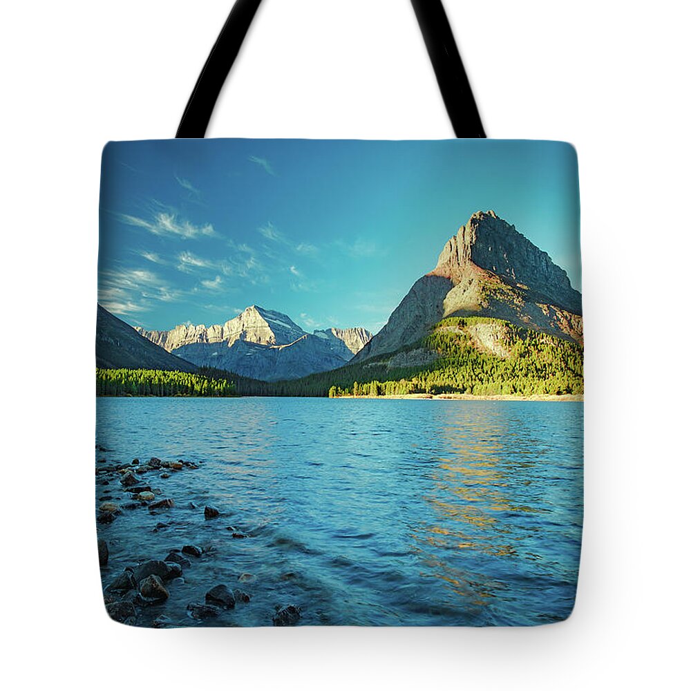 Swiftcurrent Lake Tote Bag featuring the photograph Swiftcurrent Lake by Todd Klassy