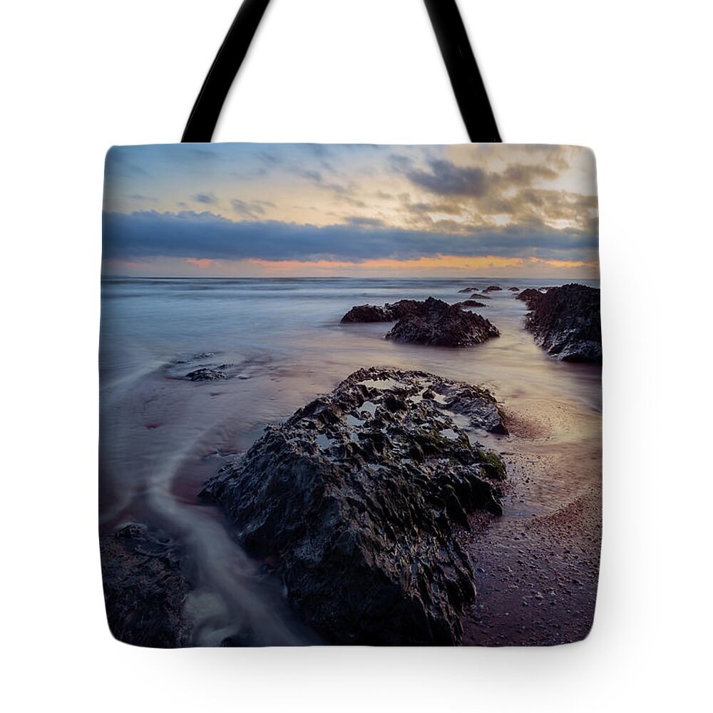 Seascape Tote Bag featuring the photograph Swirling water around rocks at Croyde, North Devon by Victoria Ashman