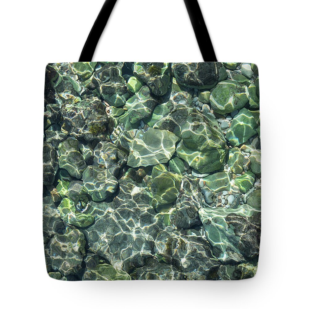 Sea Water Tote Bag featuring the photograph Teal sea water and reflections of sunlight by Adriana Mueller