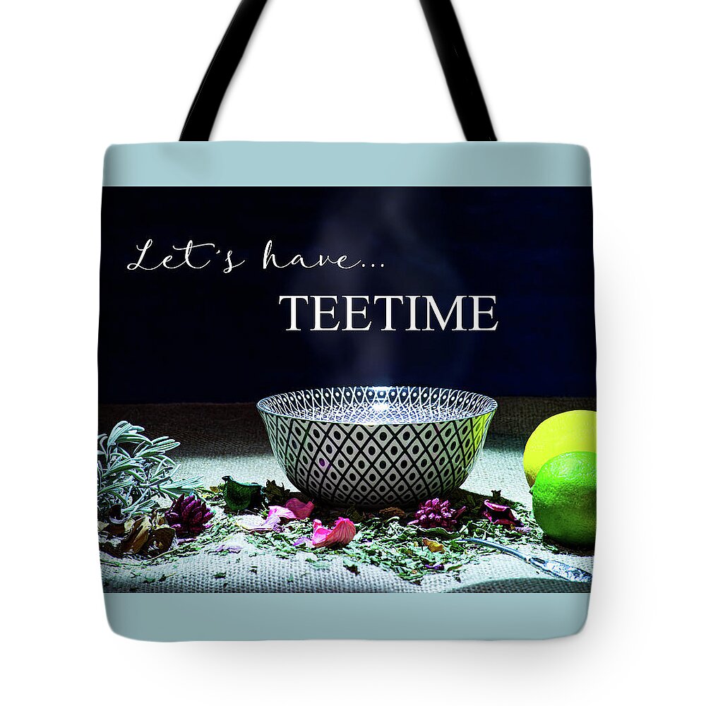 Inscription Tote Bag featuring the photograph A drinking bowl with tea and herbs. by Bernhard Schaffer
