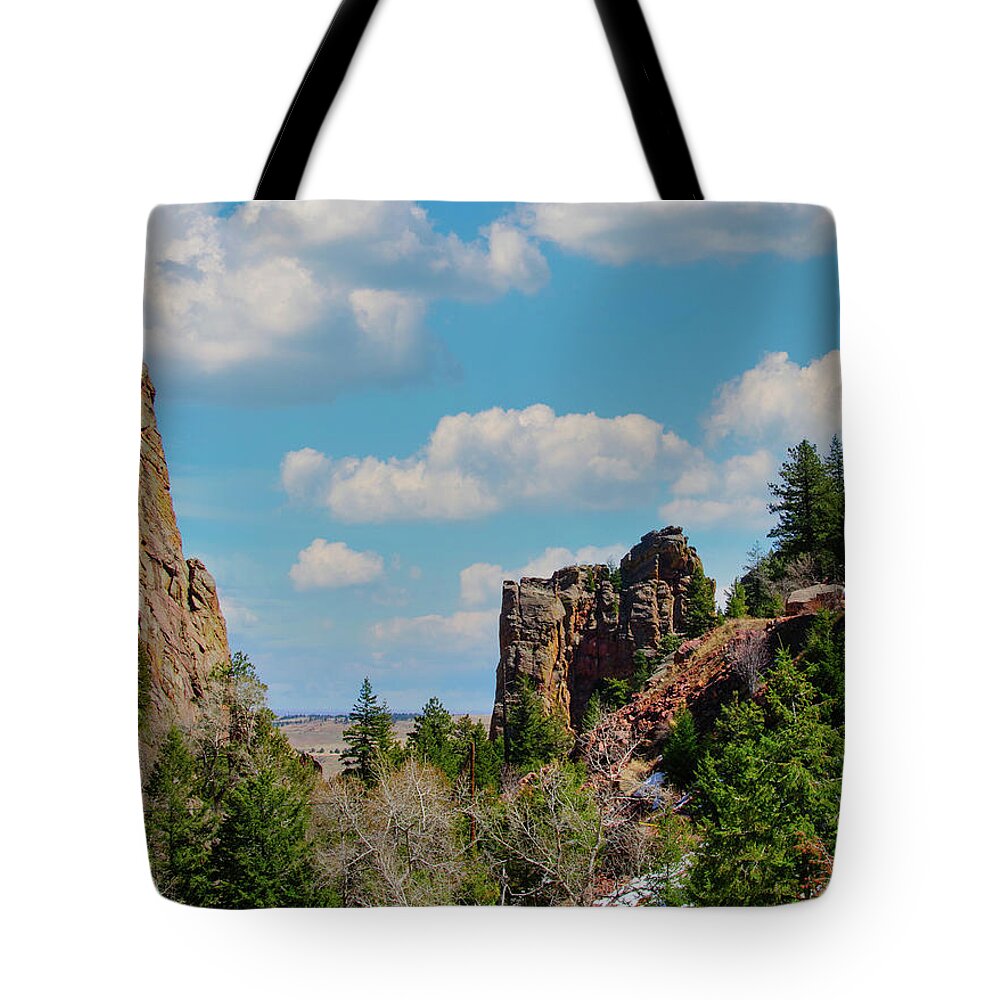 Rock Climber Tote Bag featuring the photograph The Bastille, Rock formation in the shape of a tower in Eldorado Canyon State Park, Colorado by Tom Potter