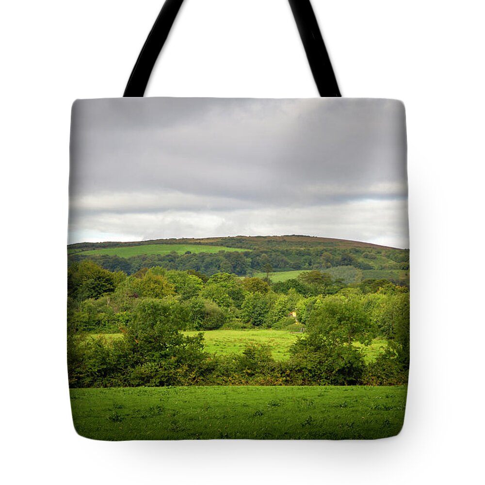 Black Hill Tote Bag featuring the photograph The Black Hill by Mark Callanan