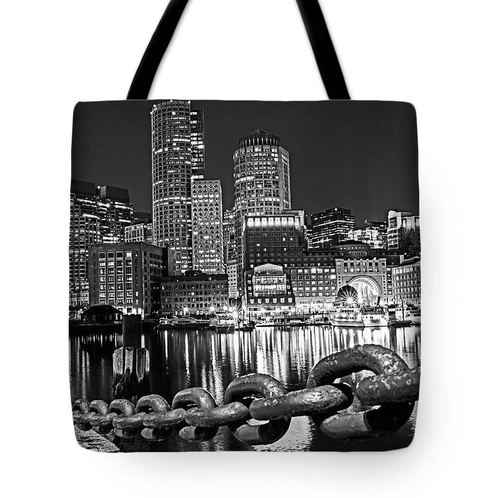 Boston Tote Bag featuring the photograph The Boston Skyline Reflected in Fort Point Channel at Night Boston Massachusetts Black and White by Toby McGuire
