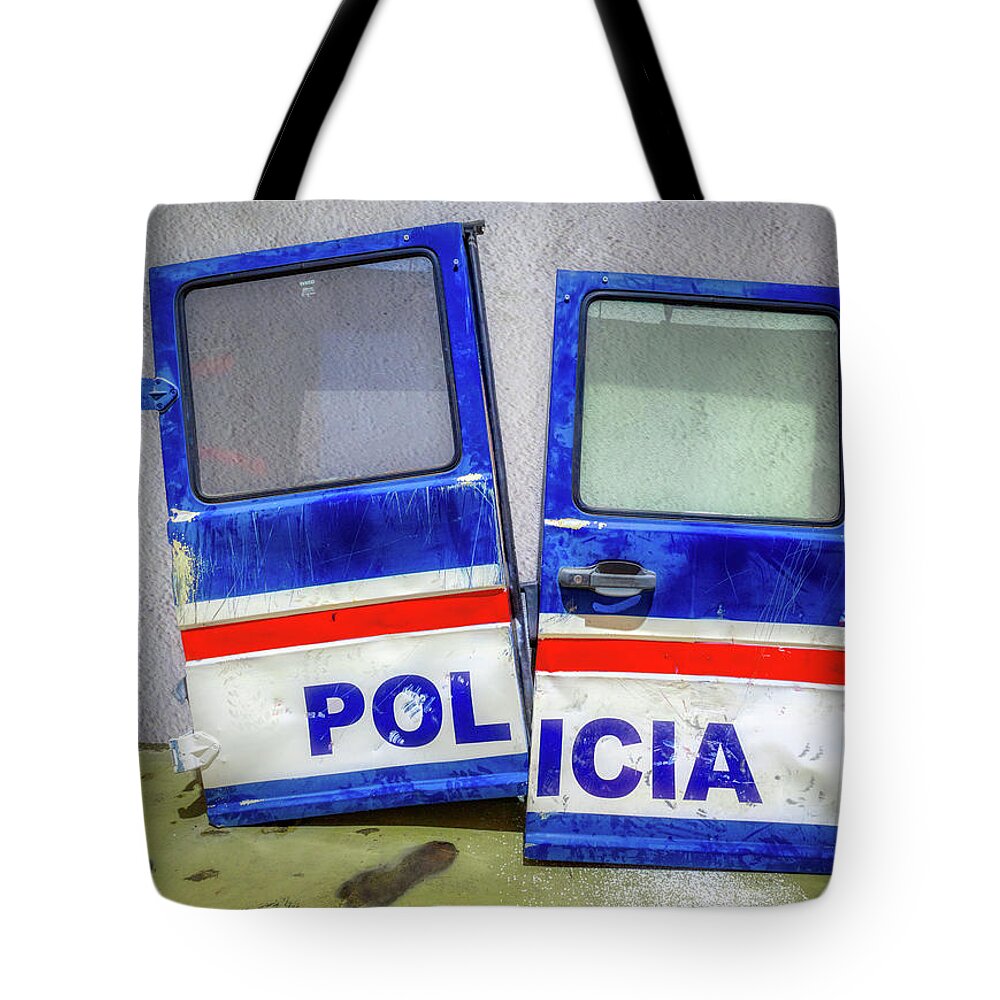 Blue Tote Bag featuring the photograph The Dangerous Innocent by Micah Offman