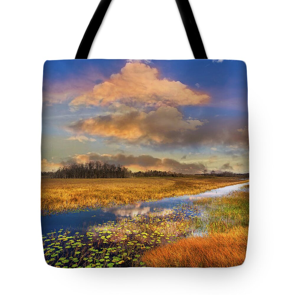 Clouds Tote Bag featuring the photograph The Everglades Sunset by Debra and Dave Vanderlaan