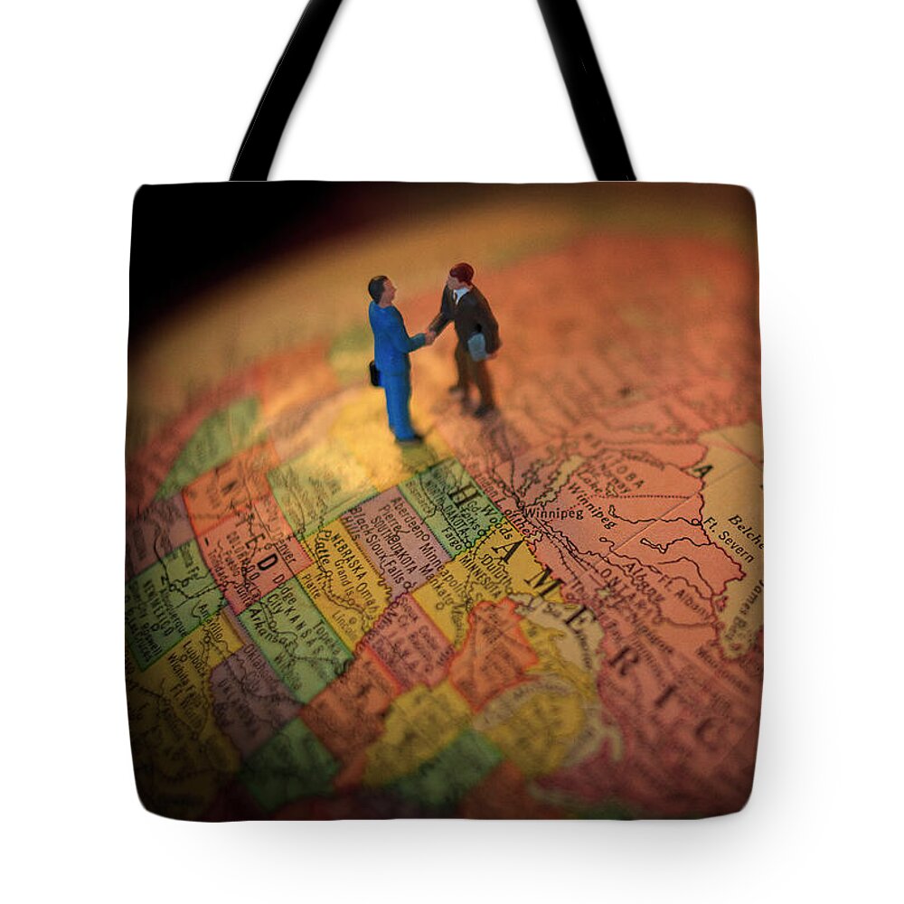World Tote Bag featuring the photograph The Handshake by Craig J Satterlee