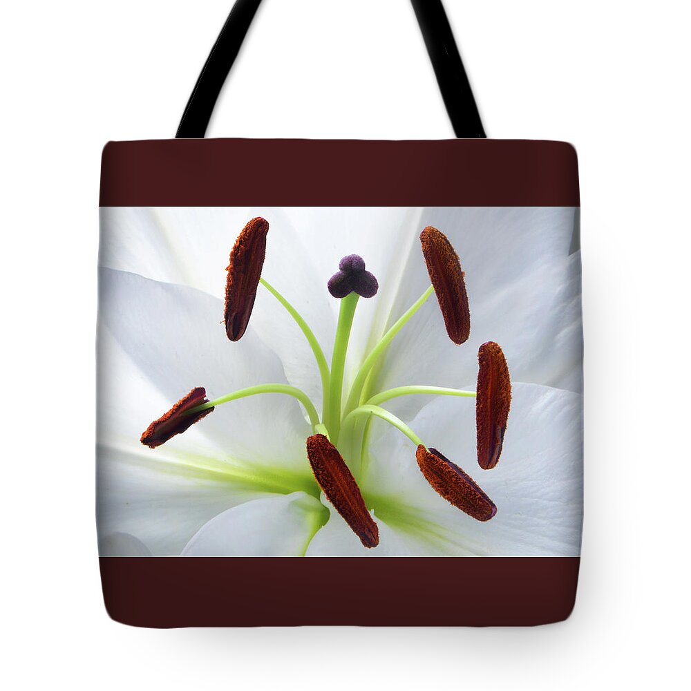 White Lily Tote Bag featuring the photograph The Heart of Lily by Terence Davis