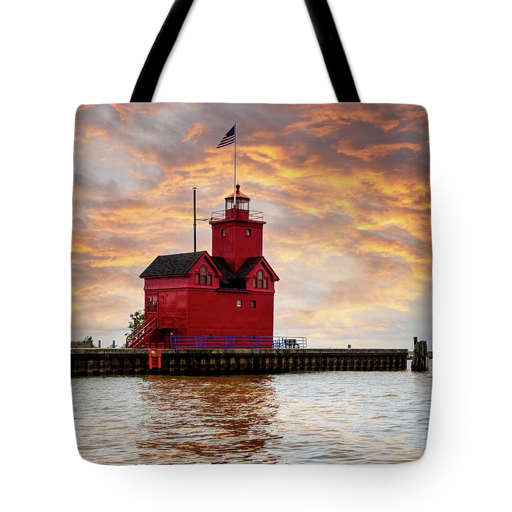 Lighthouse Tote Bag featuring the photograph The Holland Harbor Lighthouse by Debra and Dave Vanderlaan