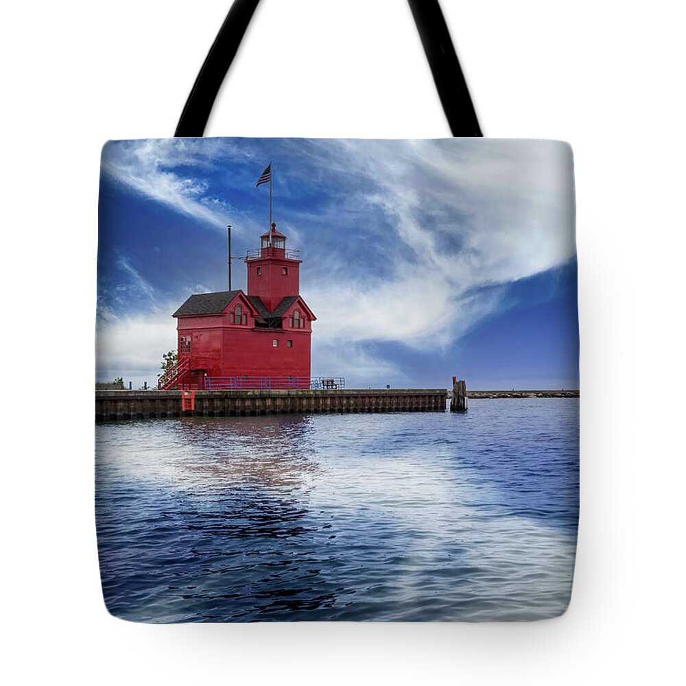 American Tote Bag featuring the photograph The Holland Harbor Lighthouse Inlet by Debra and Dave Vanderlaan