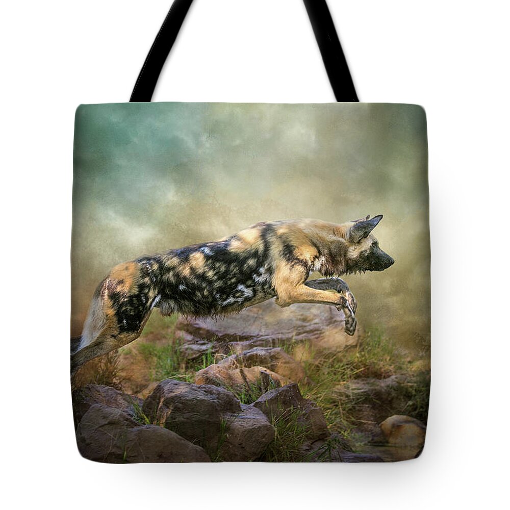African Wild Dog Tote Bag featuring the digital art The Leap by Nicole Wilde