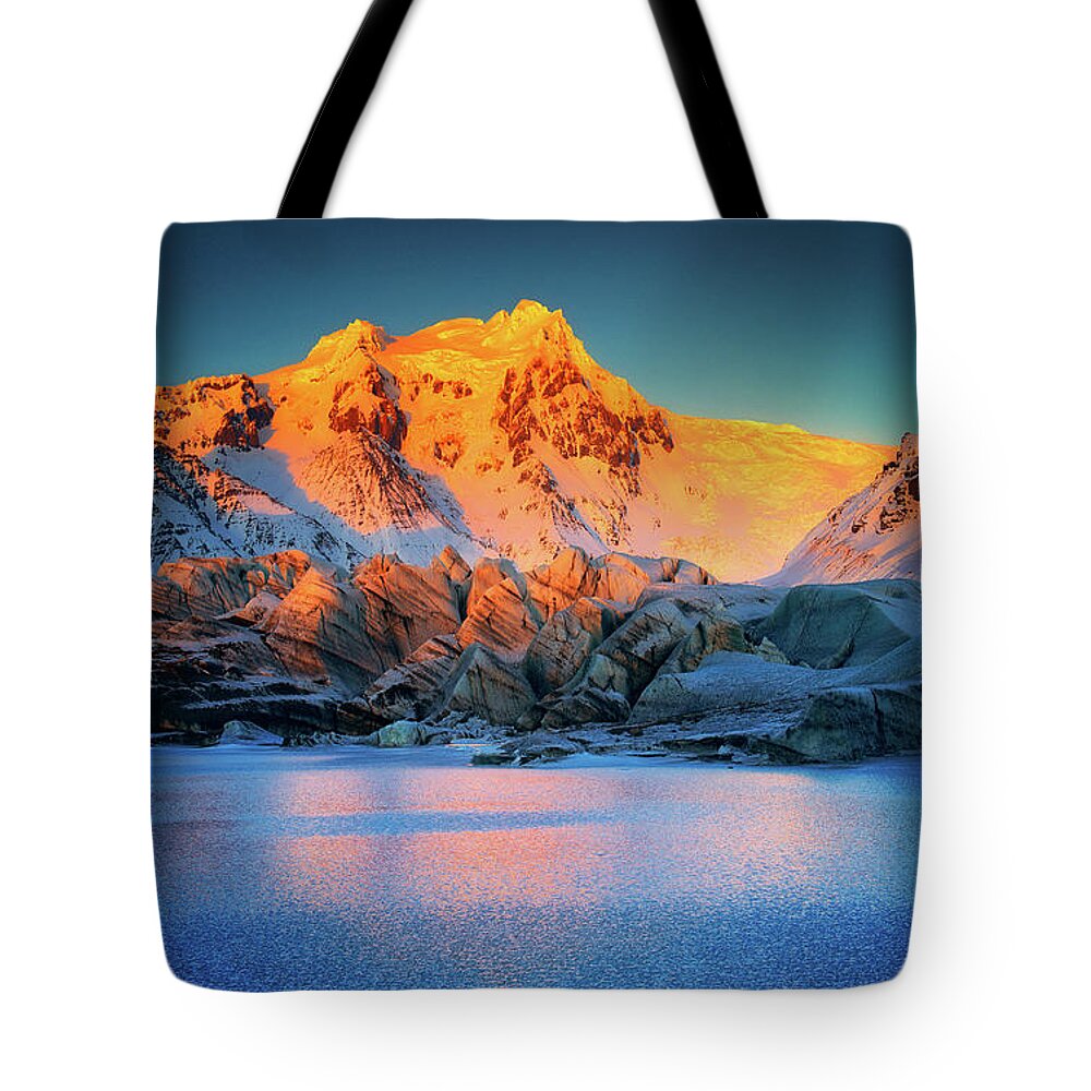 Iceland Tote Bag featuring the photograph The light at sunset by Henry w Liu