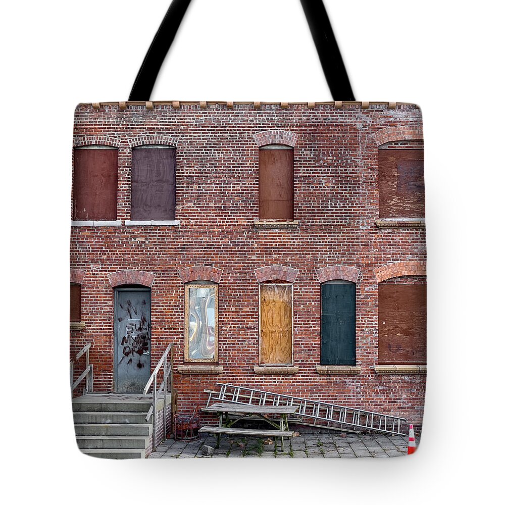 Brick Wall Tote Bag featuring the photograph The many eyes of a building by Cate Franklyn