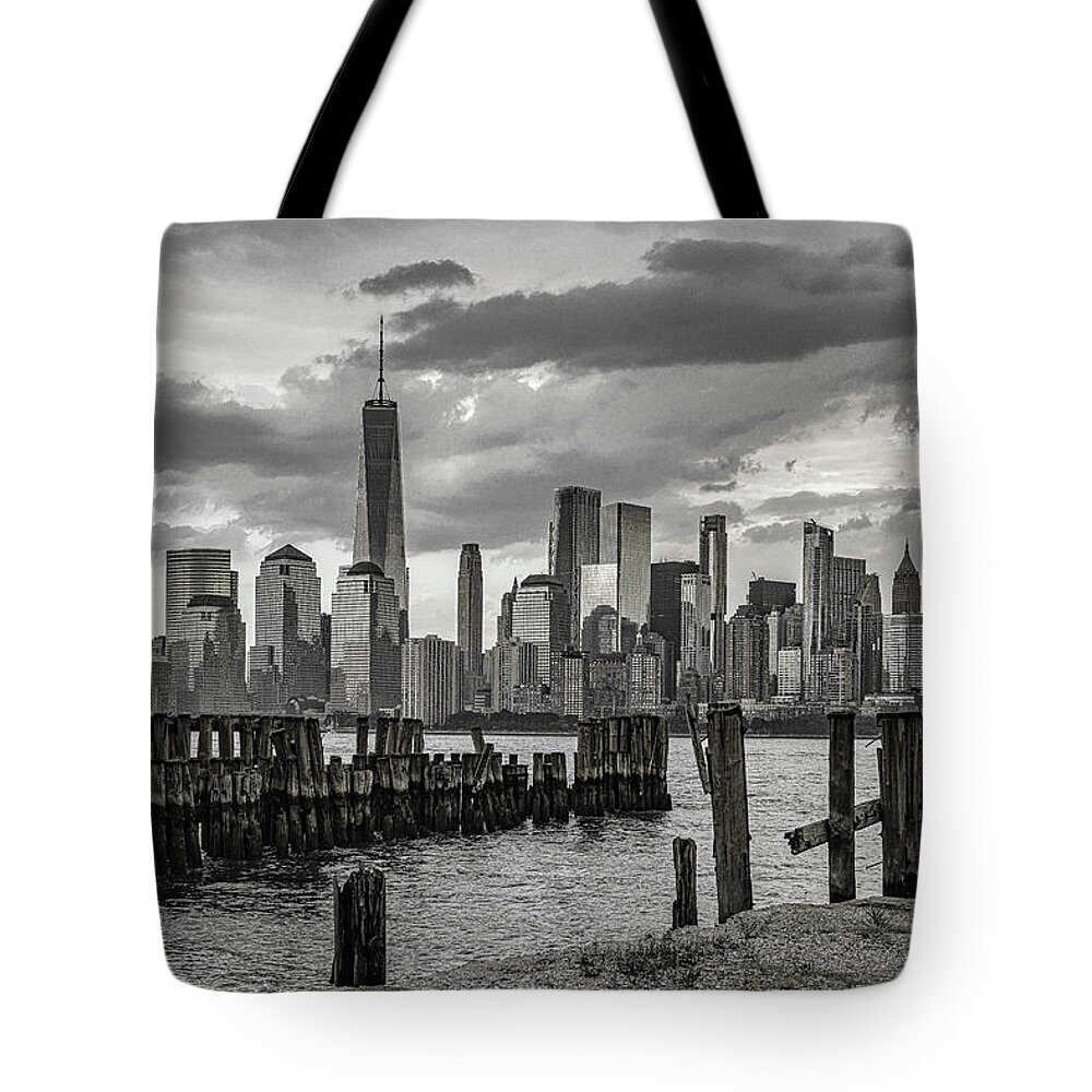 Liberty State Park Tote Bag featuring the photograph The NYC Skyline by Penny Polakoff