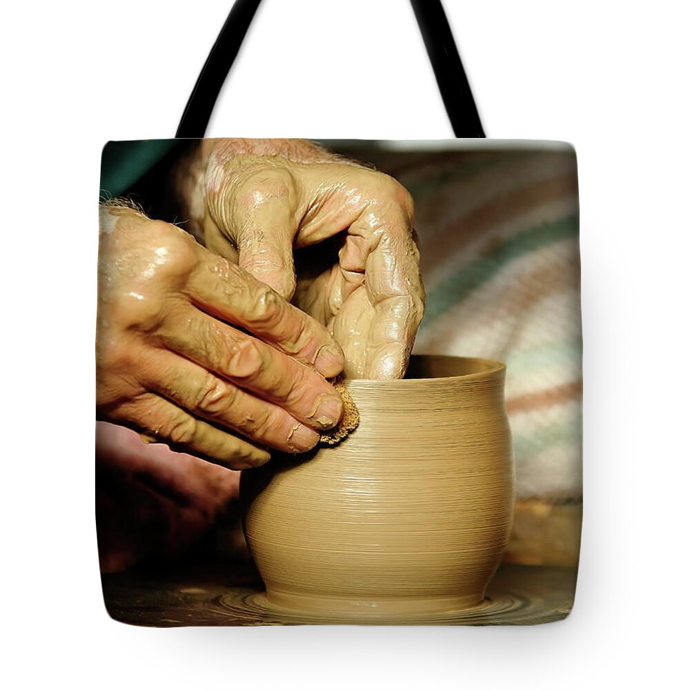Ceramic Tote Bag featuring the photograph The Potter's Hands by Lens Art Photography By Larry Trager