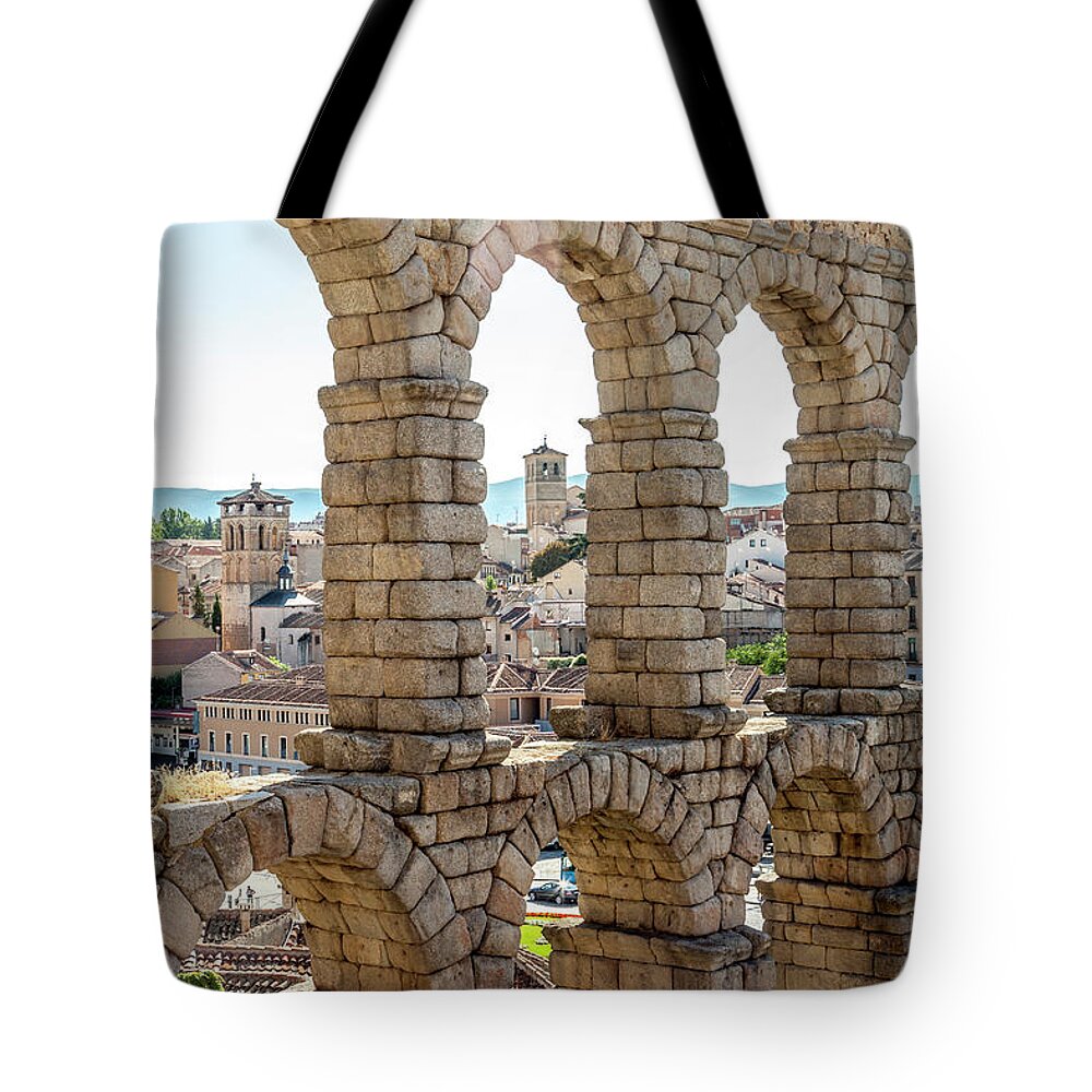 Spain Tote Bag featuring the photograph The Roman Aqueduct in Segovia by W Chris Fooshee