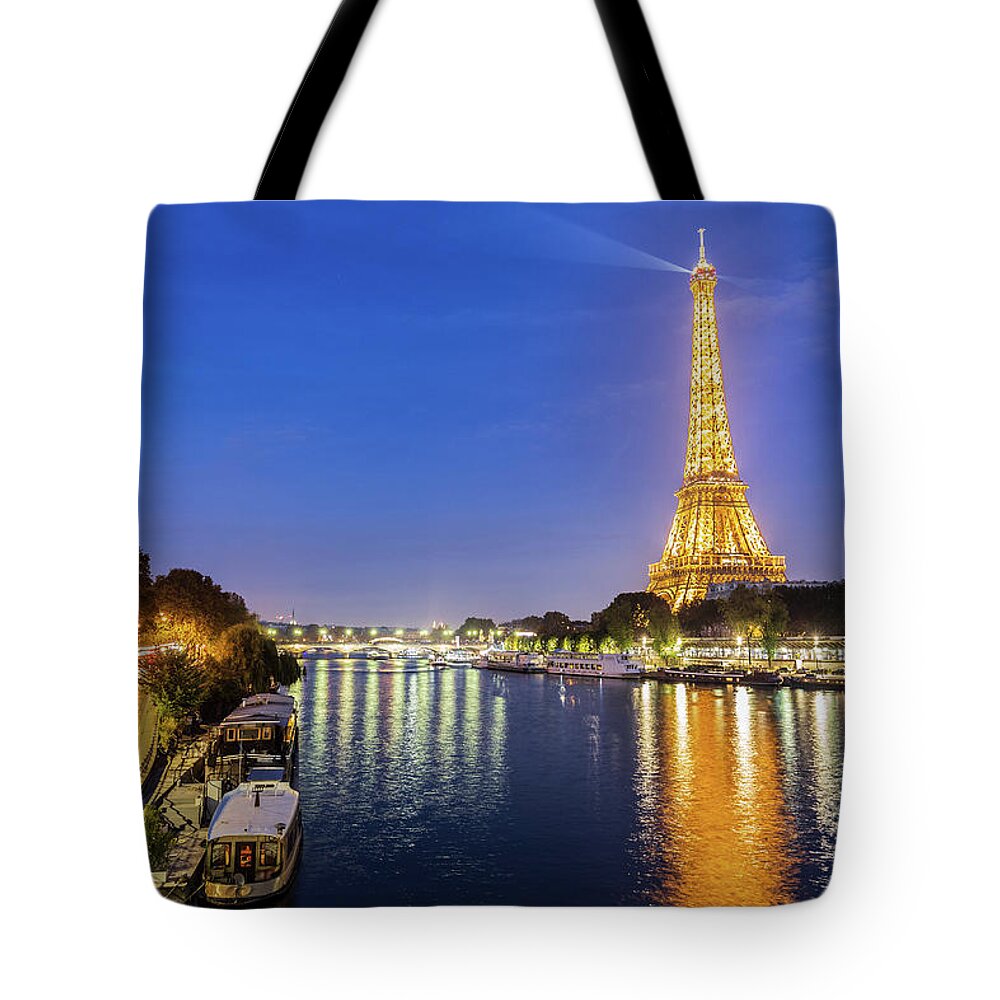 France Tote Bag featuring the photograph The Seine River by night in Paris, France by Fabiano Di Paolo