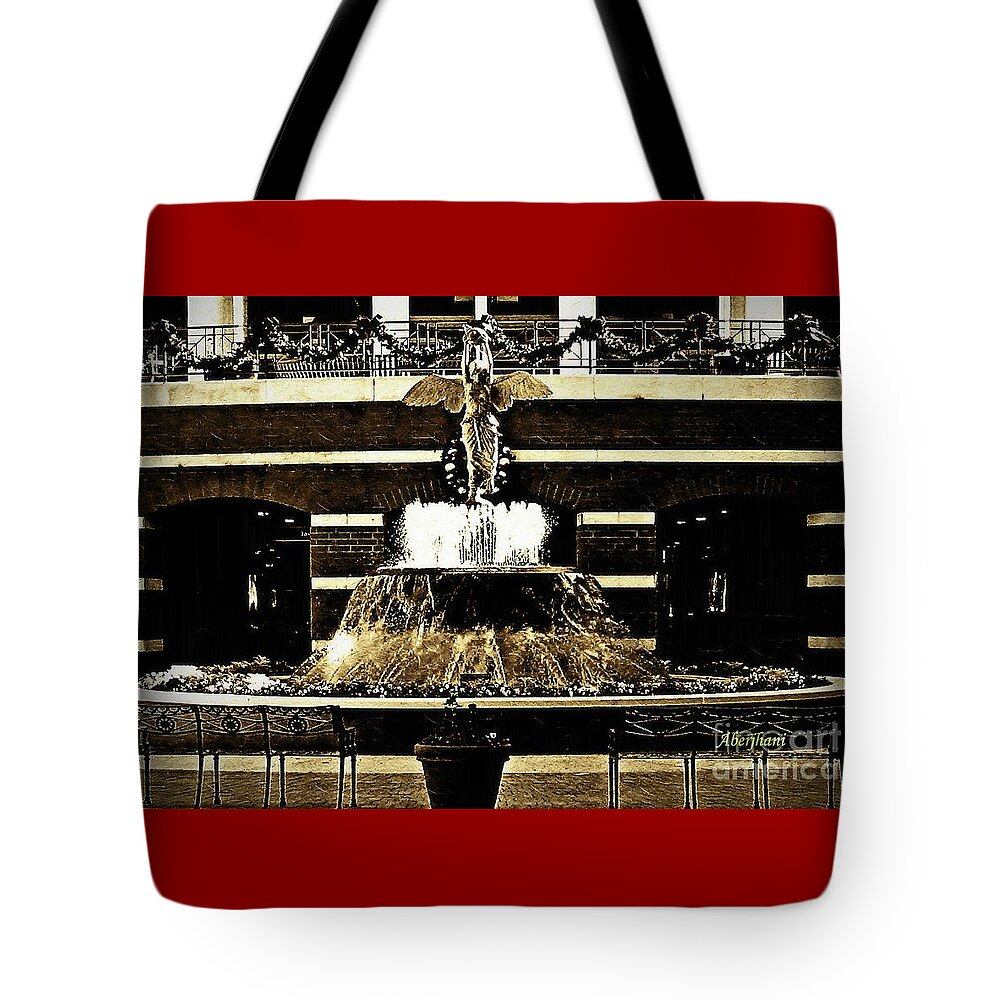 Sepia Tote Bag featuring the photograph The Sepia Angel of Flight Fountain by Aberjhani