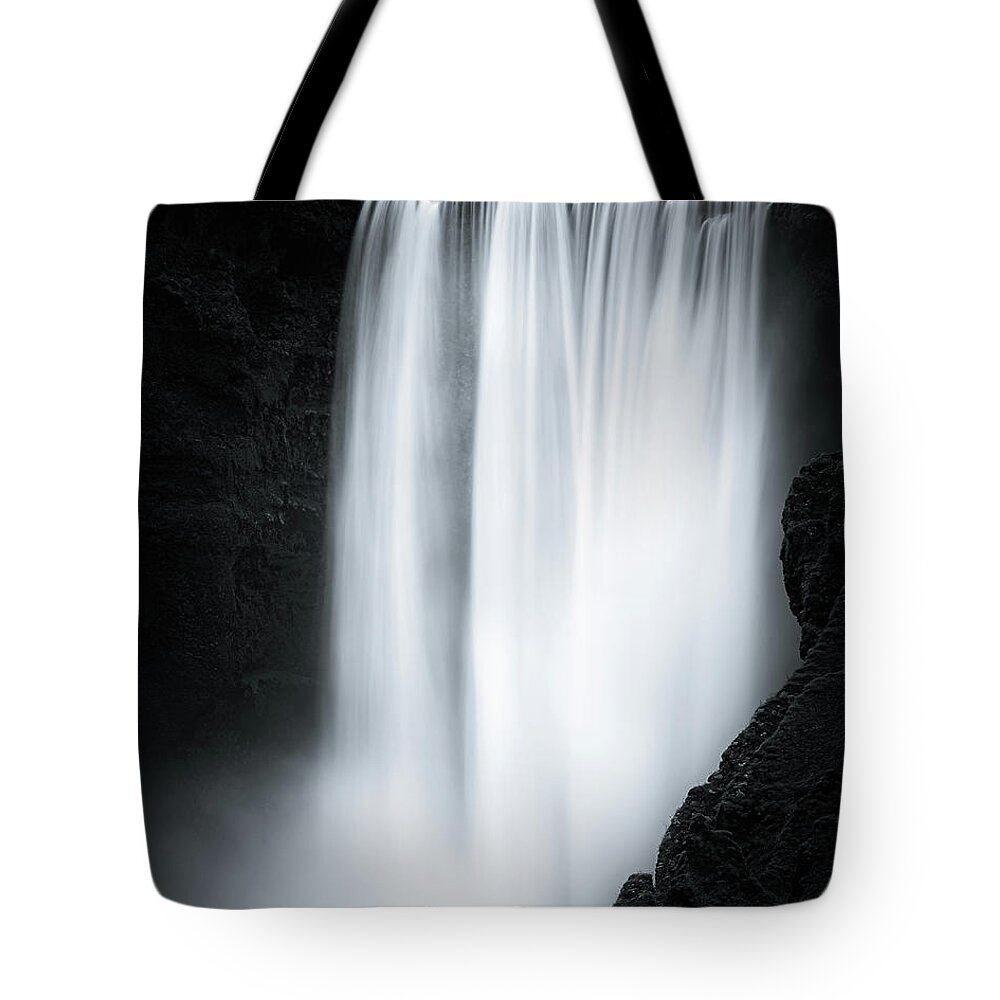 Attraction Tote Bag featuring the photograph The Skogafoss in Black and White by Henk Meijer Photography