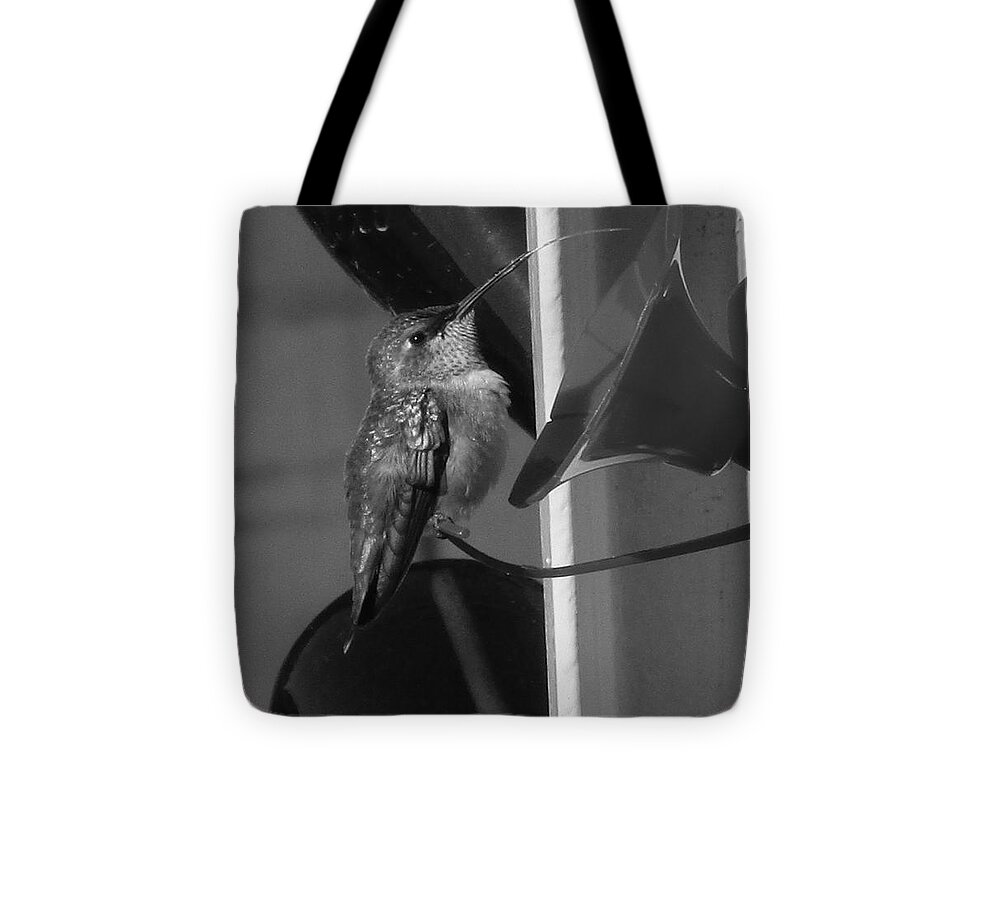 Tongue Tote Bag featuring the photograph The tongue by Marie Neder