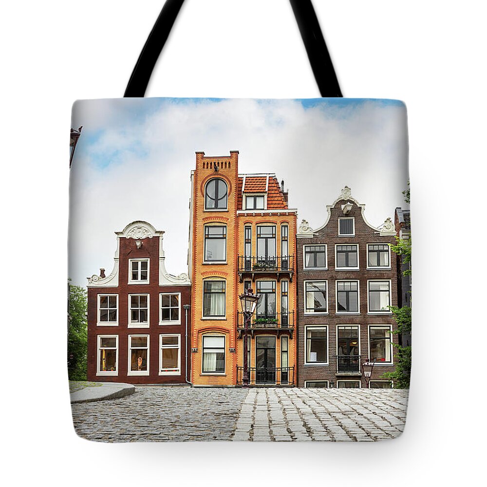 Amsterdam Tote Bag featuring the photograph Traditional Dutch townhouses in Amsterdam by Jane Rix