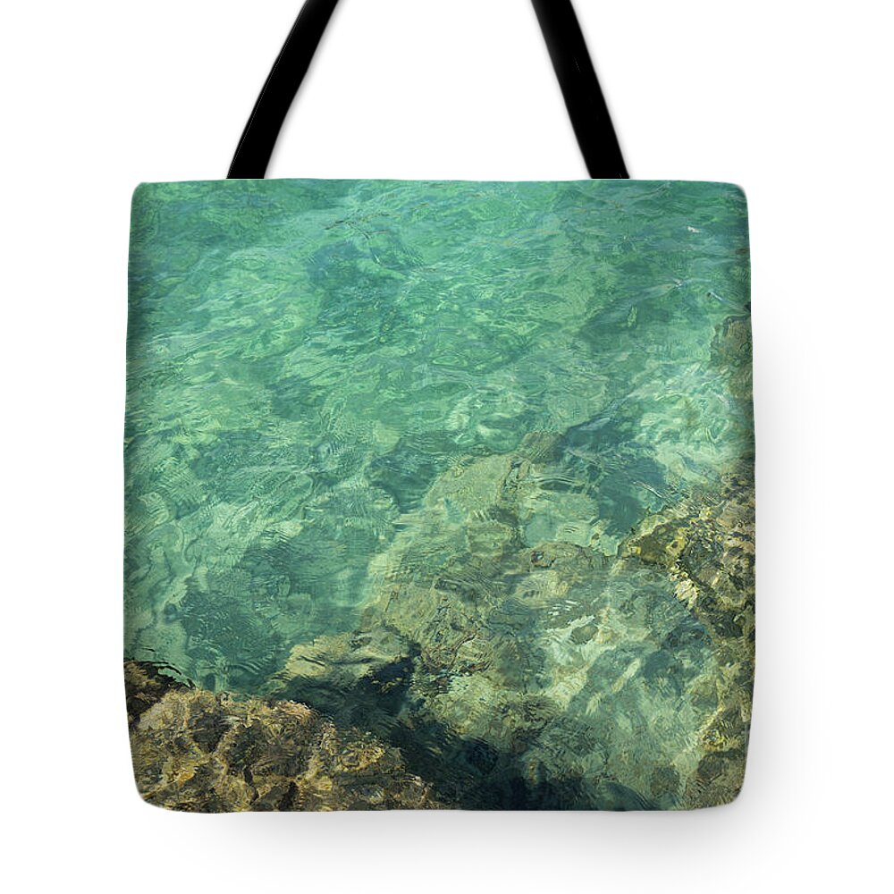 Turquoise Tote Bag featuring the photograph Turquoise blue water on the Mediterranean coast by Adriana Mueller