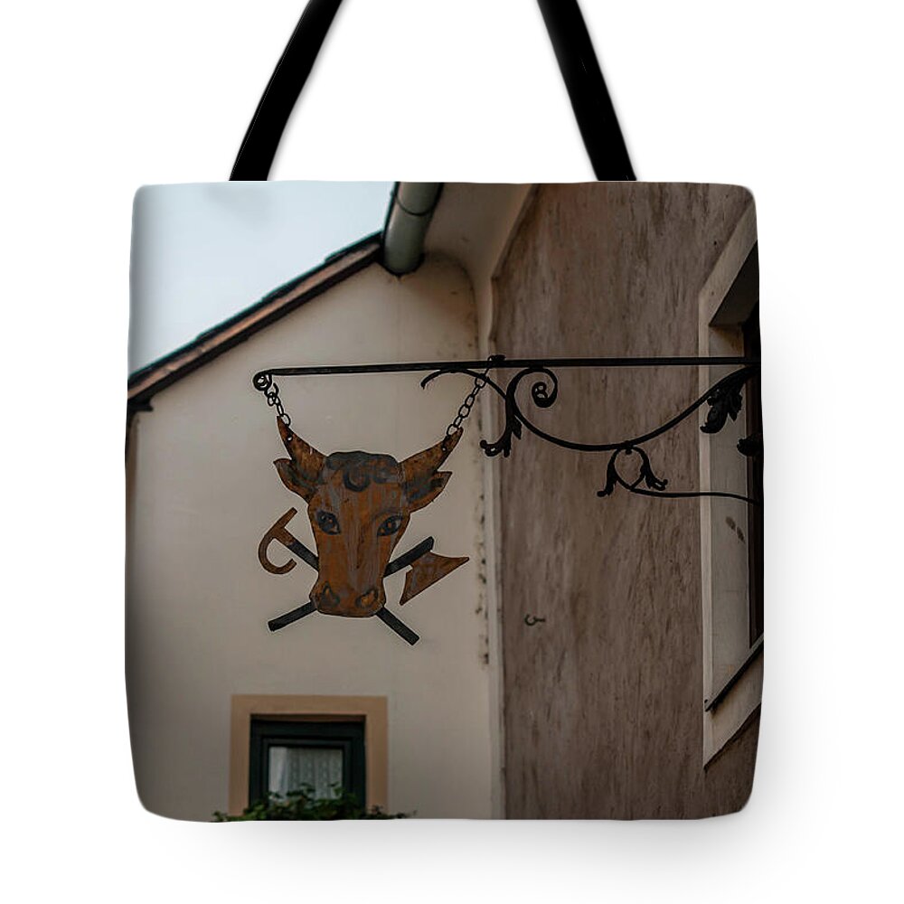  Tote Bag featuring the photograph Twilight Durnstein. Forged Sign with Cow Head by Jenny Rainbow