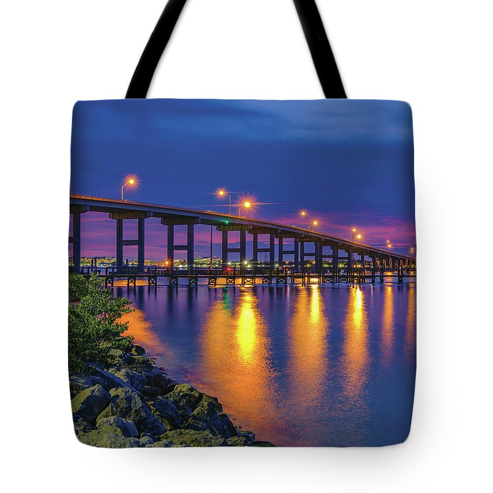Fort Pierce South Bridge Tote Bag featuring the photograph Twilight over Fort Pierce South Bridge A Serene View of the Waterway by Kim Seng