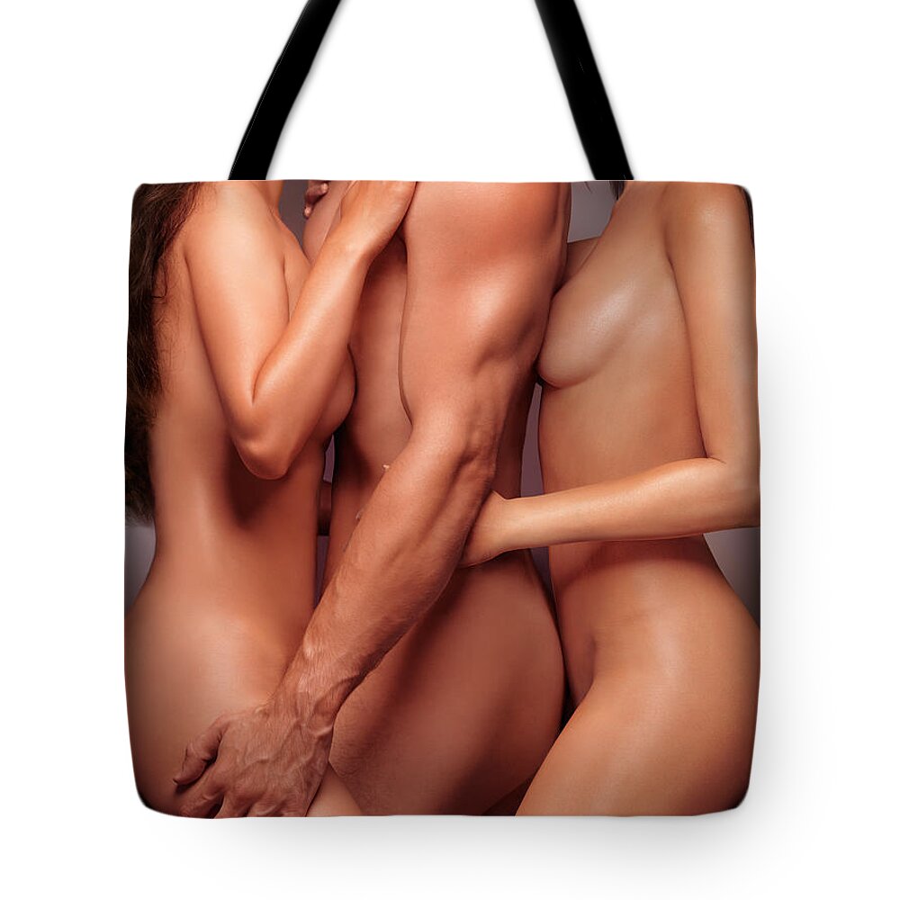 Two beautiful naked women leaning against nude man Tote Bag by Maxim Images Exquisite Prints picture