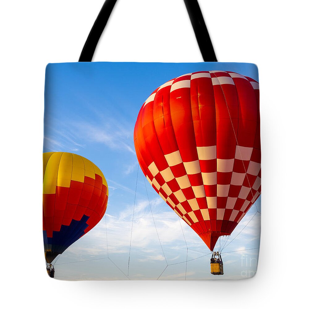 Hot Air Balloons Tote Bag featuring the photograph Up Up And Away Florida Hot Air Ballon Festival Tethered Balloons by L Bosco