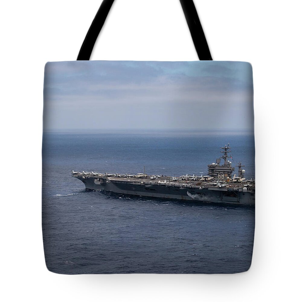 Vintage Tote Bag featuring the painting USS Nimitz CVN 68 conducts flight operations during a composite training unit exercise. by MotionAge Designs