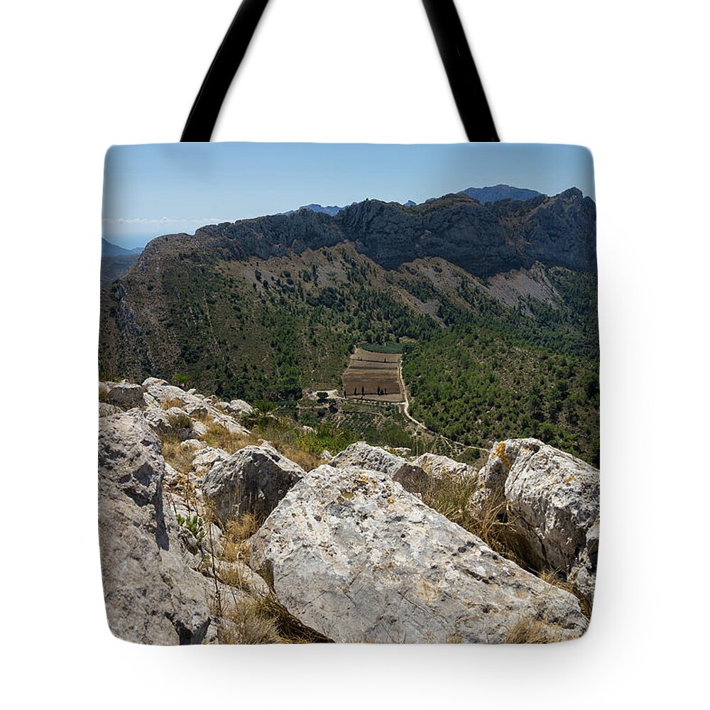 Mountains Tote Bag featuring the photograph Mountain range and rocks on the Mediterranean coast by Adriana Mueller