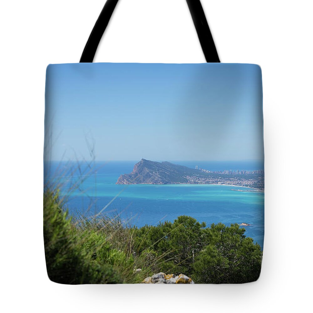 Spain Tote Bag featuring the photograph View of the coast and the Mediterranean sea in Benidorm by Adriana Mueller