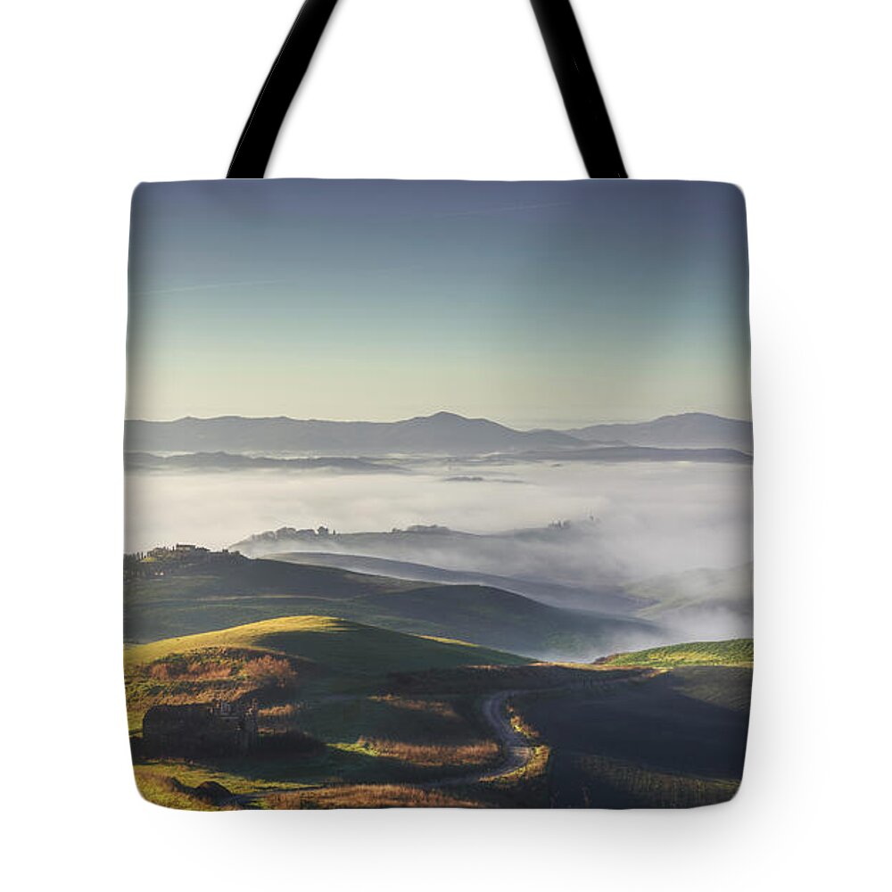 Tuscany Tote Bag featuring the photograph Volterra foggy landscape by Stefano Orazzini