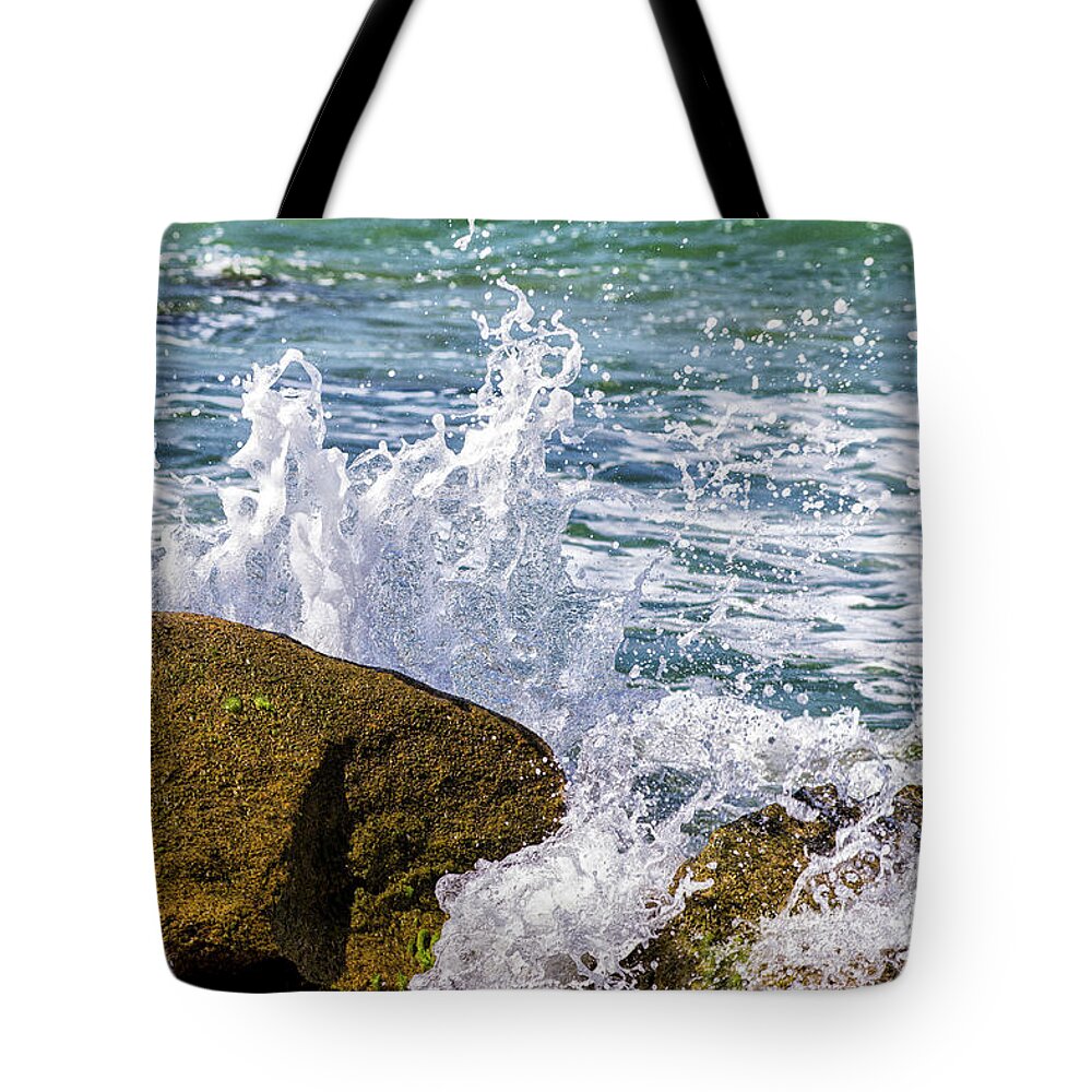 Wave Tote Bag featuring the photograph Wave Break Against Rocks on Atlantic Beach by Bob Decker