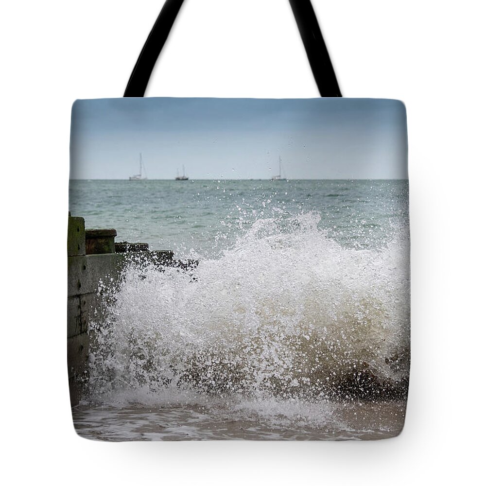Eastbourne Tote Bag featuring the photograph Wave splash by Andrew Lalchan